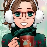 Cute brunette holding a cup of hot cocoa in the winter